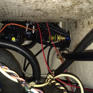 underside of starboard hatch mounted washdown pump just above gas tanks still have a few wires to reattach but should work well