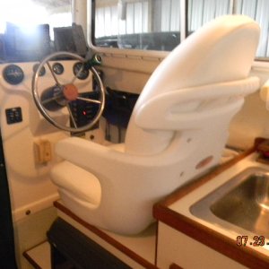This a Tempress Elite High back Seat. Cost around $200.00  It"s about 2"(The Bottom) highter than the Org. I could not us a swivel  Rides Great