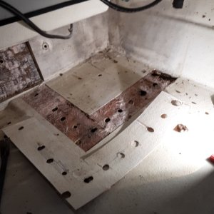holes from the gas tank mounts