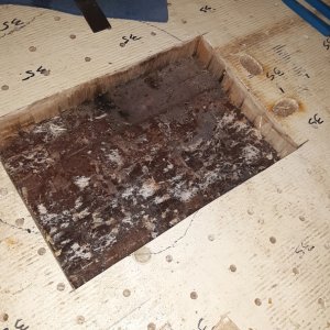 this is the area of dark shavings under the galley, it was rotten and there was a void there where they didn't get enough resin to bond the balsa to the bottom skin