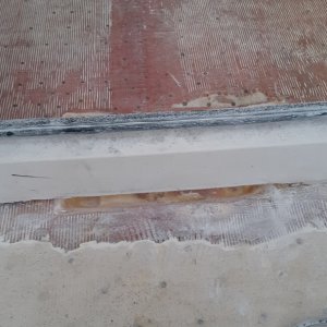 cockpit side of sump under step in door