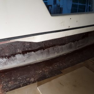 thickened epoxy troweled on and a thick bead along the bottom