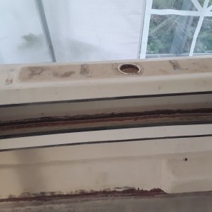cleaned out the paint and old adhesive so I can put a fillet and some glass in to hold this storage pocket bottom in place.  both sides are busted loose on the bottom. factory only uses some kind of adhesive to hold these together
