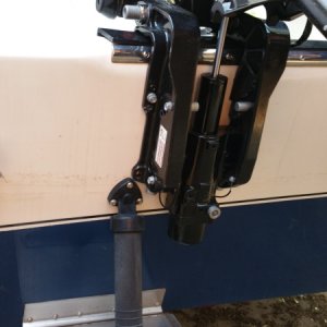View of kicker motor bracket in relation to trim tab hardware