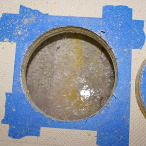 Inspection Plates - Cabin sole just forward of door.  Condensation running down sides and under unsealed cabin sole is the likely source of the slight moisture.  Dries completely if the plate is left off while the boat is moored or on the hard.