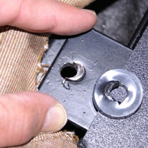 Helm Seat - Bolt hole.  This is the useless, overdrilled hole into which the longer bolt in the previous photo was wedged, not screwed.  I filled it with JB Weld and a threaded stud.