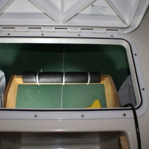 Media 'V-Berth Storage Install -DSC06190 Closed cell foam and a little wood divider to keep things in place.  The gray bags on either side hold spare props.' in album 'New LED Anchor Light & Radar Reflector Assembly'
