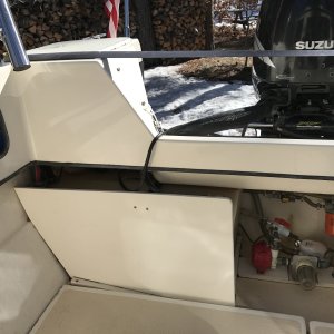 Starboard fuel tank behind panel with fuel selector switch. Tank labeled 30 gallons.