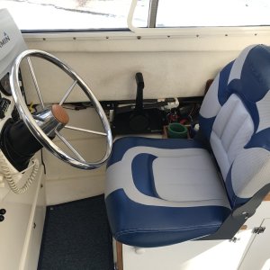 Replaced standard helm station seat with Cabela's Pro Fisherman High-Back Seat and added 20 degree wedge to steering wheel for additional leg room.