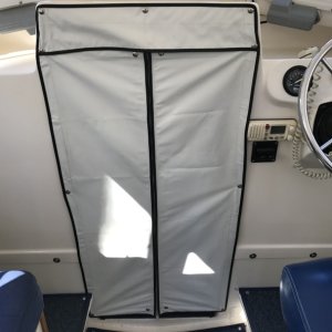 Zippered vinyl V-berth privacy curtain.