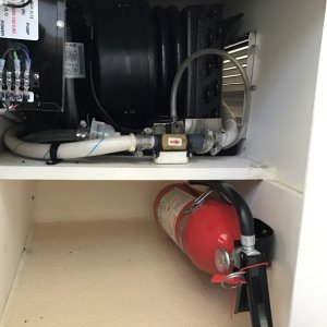 Mermaid air conditioner, fire extinguisher and additional storage in cabinet under passenger seat.