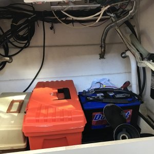 Storage cabinet under galley counter. room for two 12 volt batteries for inverter.