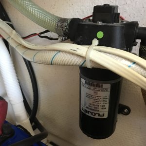 Washdown pump in galley counter cabinet.