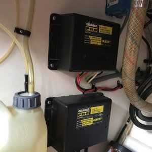 Two Guest dual battery chargers in galley counter cabinet.
