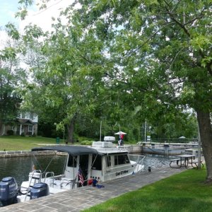 'Mooring' above a Rideau canal lock 'on the wall' is cheap and unlimited with a seasonal pass (for 'locking' a seasonal pass is also advised for this Triangle Loop was about $230 Canadian for us).