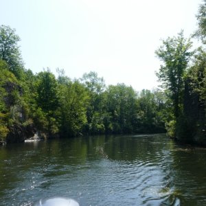 Typical Rideau canal leading to lock around  a dam and waterfall.