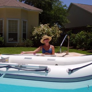 Mercury 310 Air Deck in the pool.  A Honda air cooled 2.5 kicked it along.