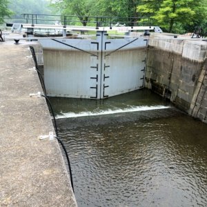 Richelieu typical lock, showing why 5.5 ft is the max draft advised.   Maneuver in for Eileen to take the bow cable, and me the aft cable.  All the ancient valves and gates are turned by  hand, mainly college kids on summer break but all very polite and friendly