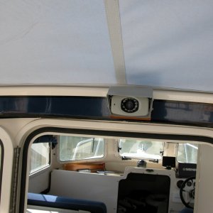 Media 'LCD Backup Camera above cabin door. The small 'black dot' to the left of the lense is the mic pickup. I use the mic to monitor the cockpit crew for docking or other feedback.' in album 'Backup system LCD color monitor beside GARMIN 2006C. Audio from camera mic is fed to monitor.'