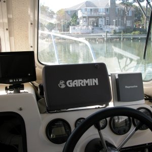 Media 'Rear view cockpit camera LCD monitor positioned to the left of the GARMIN 2006C display. Though the location was best for viewing, it proved not so because of water spray when the center window is open.' in album 'Backup system LCD color monitor beside GARMIN 2006C. Audio from camera mic is fed to monitor.'