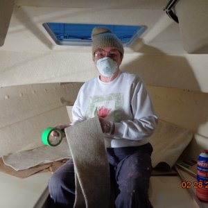 Working on installing the hull liner in the V-berth.