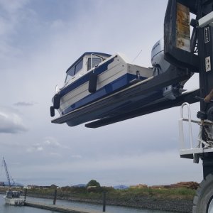 Media 'Almost there' in album 'Brand new forklift driver picking up the brand new boat from the work stand.  The experienced driver there for support.'