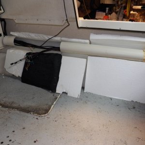 This shows the flotation foam behind the starboard panel.  I intend to reuse most of it, but fastened into place with spray foam.  When loose, they act as wedges against the panels and may have contributed to the pop rivet failures.