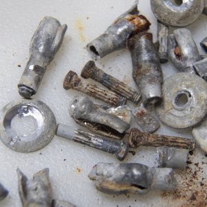 These rivets all have rusty mandrels, indicating high levels of moisture in the core even areas where the rivets didn't appear to have leaked and the wood appears okay.
