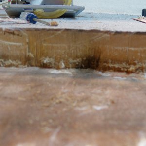Here is the scariest part.  This is looking towards the center of the boat once all of the balsa was cleaned out of the initial section.  Even though the wood is showing less damage overall, there is a spot of wet rotted wood that is basically forming a tunnel against the outer skin of the hull.  Water in this area can be pumped into other areas by the hull pounding.  I found the adhesion to be very good, so I'm hoping this doesn't go far.  But the cutout has to be expanded until I find the end of the damage.  I made quite a few cuts, expanding by about an inch at a time, which is the amount that my vibrating saw could easily remove.