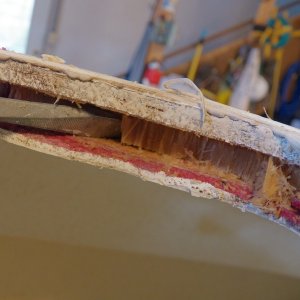 The deck hatch was removed to find saturated balsa core.  It is so wet that the wood has a waxy translucent look, kind of like rotten celery.  There was a bead of caulking around the inside and the outside of the hatch.  The outside caulking had failed (or the screws) and the inside caulking had kept the secret.