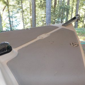 Here's the deck with most of the hardware removed.  Even if the holes were okay (which it was on the anchor roller), I'm going to wait months before filling them in hopes that moisture will escape from all of the openings.