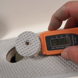 I was able to get a moisture reading well away from the leaking deck fittings when I drilled a hole for the gas tank deck fill.  This shows that the balsa core is saturated throughout the boat.  The wood looks perfect, but it probably would not have lasted long at this moisture content.