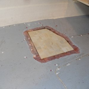 I could use heat to move core moisture around, but it looked like it was basically dried out the same as any lumber in my shop, so I cut the replacement piece for a trial fit.  The outlying holes have been filled, as have the old pop rivet holes.  Those will be drilled to accept stainless steel screws to hold the seat box.