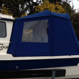 My canvas guy likes fabric where the frames are to give a bit more privacy aboard. I had thought a small window but we'll try this first.  We put the potty in the cockpit so this is going to be easy to enclose on the inside with snap up shower curtain