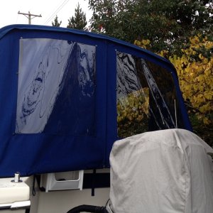 Media 'Back window port side has snap on cover, snaps on bows inside will take shower curtain for potty privacy' in album 'Early fitting'