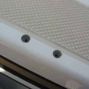 bracket holes re-drilled and chamfered