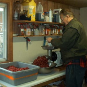 Grinding burger in the outdoor kitchen.JPG