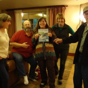Susan shows a photo of her
next boat to Cathy, Jim,
Amy & Joe