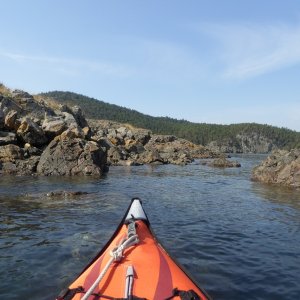 Exploring the various rock formations on the outside of Watmough bay