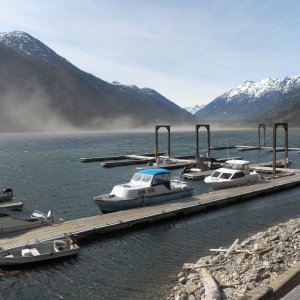 Media 'Pulled into Stehekin under gale force winds. The cloud is dust and sand blown off of the spit at the mouth of the Stehekin River.  Restaurant closed, lodge closed, store closed.  Too early in the season.' in album 'Dropping down into Lake Chelan.'