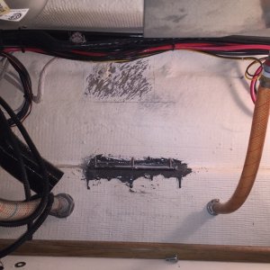 Deciding now to mount Heater higher up, where hull has been somewhat grinded, with old mounting bolts in sight, which will now become the support bracket bolts.