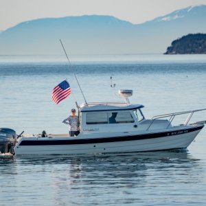 Media 'My wife and I returning from a beautiful day on the water and my youngest son was on the beach with his camera.' in album 'First fish on the boat and new name.'