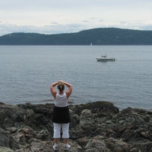 Caryn waving to unknown 16' Angler - Jones Island - May 2006