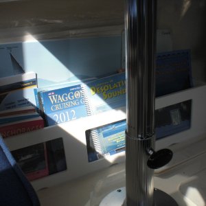 Storage bin under table for books and charts. Made out of starboard with perspex windows.