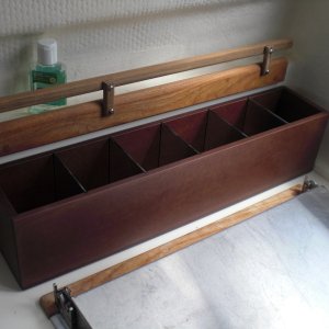 Storage bin behind the Wallas. Has removable perspex dividers to alter size of storage compartments. Also made out of PaperStone. Fixed to the bulkhead with double sided velcro.