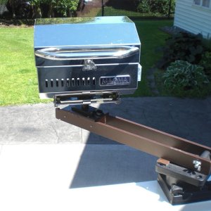 Media 'Swings out ready to BBQ.  Any grease or drips are well over the side, not on the boat.' in album 'Glued on rubber multi-deck under the anchor stock to protect the gel coat.'