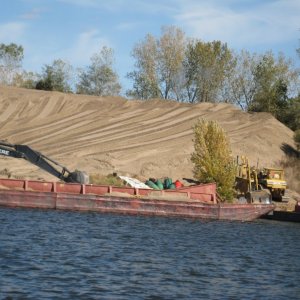 Media 'These huge sandy islands created by dredging pop up all over the river.' in album 'Mike hanging on in the lock.'