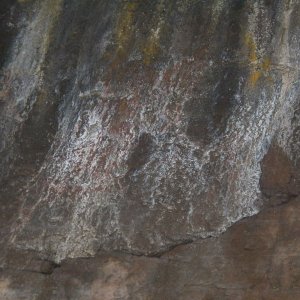 I'm not convinced that Petroglyph Cove ever had petroglyphs.  There are some reddish stains (which could indicate obscured pictographs), but there are all kinds of mineral stains on the overhang.