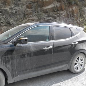 Media 'While waiting for the road to open, I took a picture of the car and boat covered with ashes and dust.  I kept the air on to keep our 140# of processed fish frozen.  The boxes of fish are now mummified in our bedding, including our Therma-rest mattresses.' in album 'Driving in on the "gravel" road to Fair Harbour we saw the prior evening's lightning strikes, mostly on the tops of the peaks.'