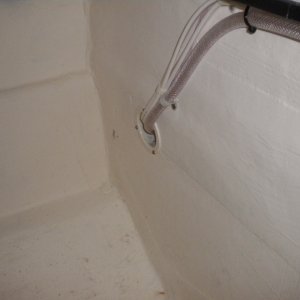 Existing holes in bulkhead used to route new water line and 12v wiring.